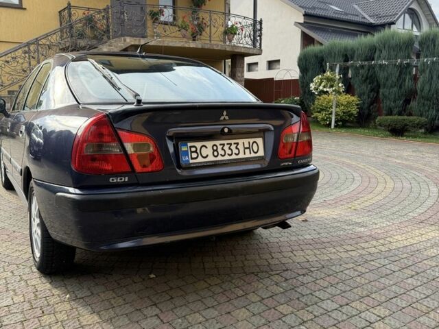 Синий Мицубиси Харизма, объемом двигателя 1.8 л и пробегом 275 тыс. км за 3000 $, фото 4 на Automoto.ua