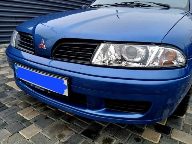 Синий Мицубиси Харизма, объемом двигателя 1.8 л и пробегом 305 тыс. км за 3999 $, фото 11 на Automoto.ua