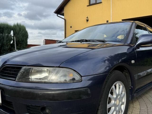 Синий Мицубиси Харизма, объемом двигателя 1.8 л и пробегом 275 тыс. км за 3000 $, фото 1 на Automoto.ua