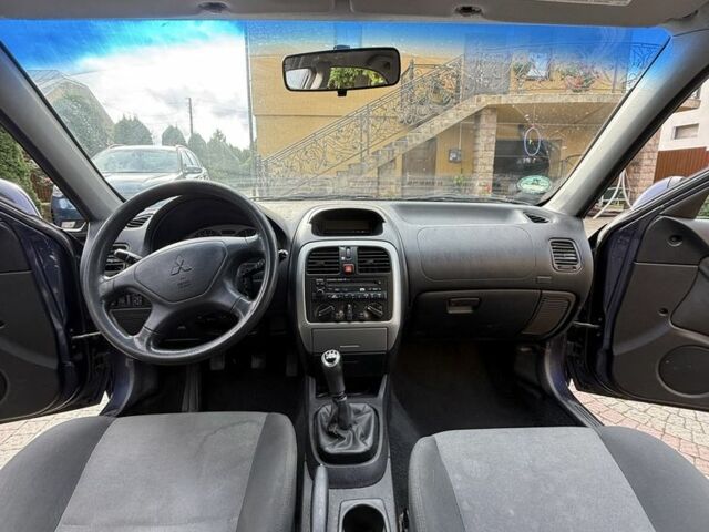 Синий Мицубиси Харизма, объемом двигателя 1.8 л и пробегом 275 тыс. км за 3000 $, фото 5 на Automoto.ua