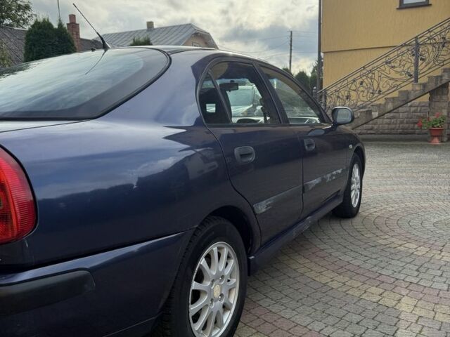 Синий Мицубиси Харизма, объемом двигателя 1.8 л и пробегом 275 тыс. км за 3000 $, фото 7 на Automoto.ua