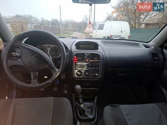 Синій Міцубісі Харизма, об'ємом двигуна 1.83 л та пробігом 198 тис. км за 2350 $, фото 6 на Automoto.ua