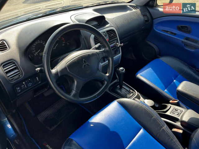 Синий Мицубиси Харизма, объемом двигателя 1.83 л и пробегом 303 тыс. км за 3000 $, фото 6 на Automoto.ua