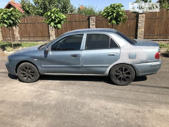 Синий Мицубиси Харизма, объемом двигателя 1.6 л и пробегом 190 тыс. км за 2600 $, фото 4 на Automoto.ua