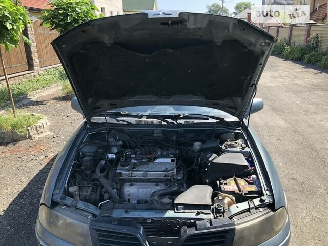 Синий Мицубиси Харизма, объемом двигателя 1.6 л и пробегом 190 тыс. км за 2600 $, фото 16 на Automoto.ua