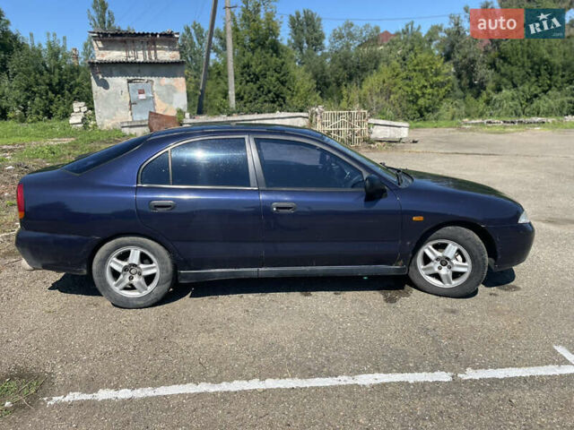 Синий Мицубиси Харизма, объемом двигателя 1.6 л и пробегом 360 тыс. км за 2200 $, фото 2 на Automoto.ua