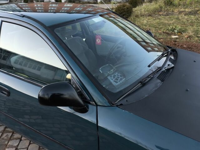 Зелений Міцубісі Харизма, об'ємом двигуна 1.6 л та пробігом 357 тис. км за 1499 $, фото 7 на Automoto.ua