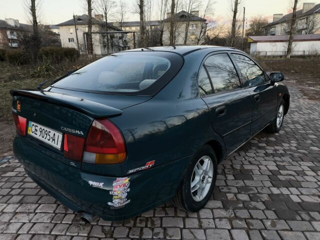 Зелений Міцубісі Харизма, об'ємом двигуна 1.6 л та пробігом 357 тис. км за 1499 $, фото 1 на Automoto.ua