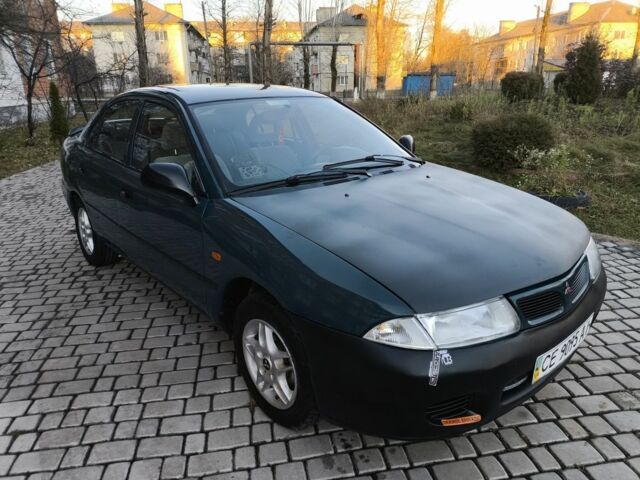 Зелений Міцубісі Харизма, об'ємом двигуна 1.6 л та пробігом 357 тис. км за 1499 $, фото 8 на Automoto.ua