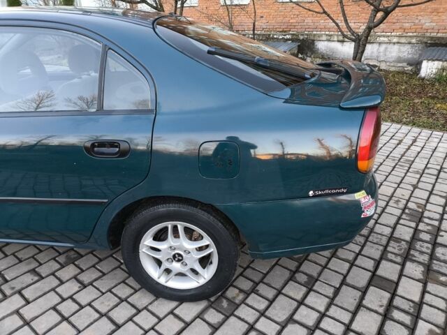 Зелений Міцубісі Харизма, об'ємом двигуна 1.6 л та пробігом 357 тис. км за 1499 $, фото 11 на Automoto.ua