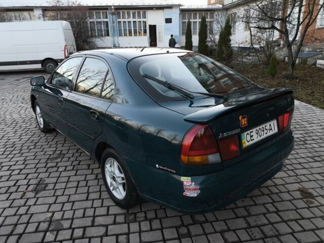 Зелений Міцубісі Харизма, об'ємом двигуна 1.6 л та пробігом 357 тис. км за 1499 $, фото 13 на Automoto.ua