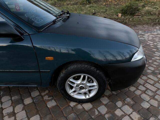 Зелений Міцубісі Харизма, об'ємом двигуна 1.6 л та пробігом 357 тис. км за 1499 $, фото 17 на Automoto.ua