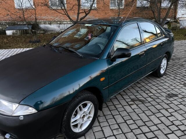 Зелений Міцубісі Харизма, об'ємом двигуна 1.6 л та пробігом 357 тис. км за 1499 $, фото 12 на Automoto.ua