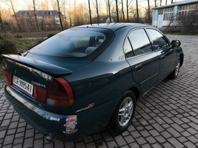 Зелений Міцубісі Харизма, об'ємом двигуна 1.6 л та пробігом 357 тис. км за 1499 $, фото 9 на Automoto.ua