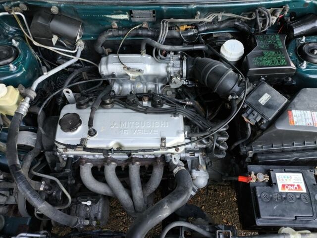 Зелений Міцубісі Харизма, об'ємом двигуна 1.6 л та пробігом 357 тис. км за 1499 $, фото 15 на Automoto.ua