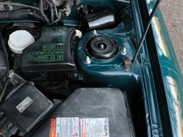 Зелений Міцубісі Харизма, об'ємом двигуна 1.6 л та пробігом 357 тис. км за 1499 $, фото 14 на Automoto.ua