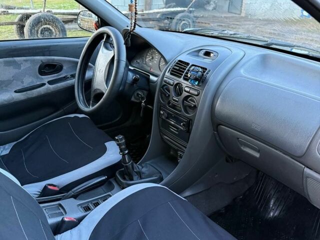 Зеленый Мицубиси Харизма, объемом двигателя 1 л и пробегом 475 тыс. км за 1299 $, фото 7 на Automoto.ua