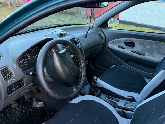 Зеленый Мицубиси Харизма, объемом двигателя 1 л и пробегом 475 тыс. км за 1299 $, фото 8 на Automoto.ua