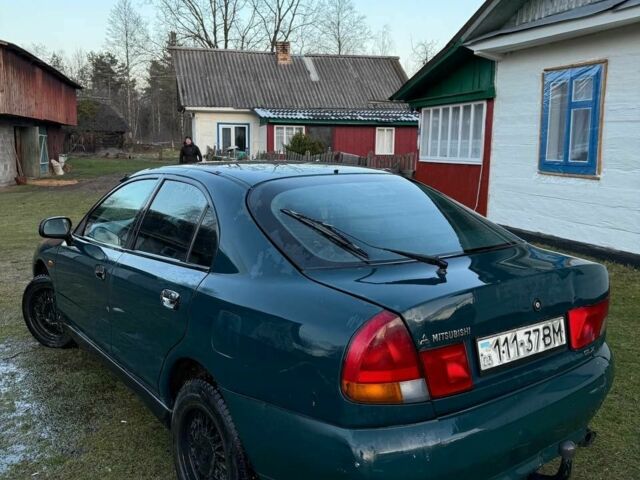 Зеленый Мицубиси Харизма, объемом двигателя 1 л и пробегом 475 тыс. км за 1299 $, фото 3 на Automoto.ua