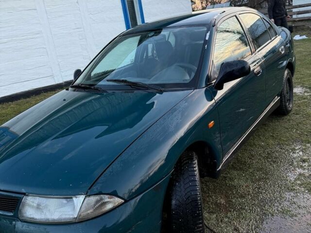 Зеленый Мицубиси Харизма, объемом двигателя 1 л и пробегом 475 тыс. км за 1299 $, фото 4 на Automoto.ua