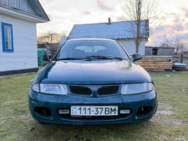 Зеленый Мицубиси Харизма, объемом двигателя 1 л и пробегом 475 тыс. км за 1299 $, фото 5 на Automoto.ua