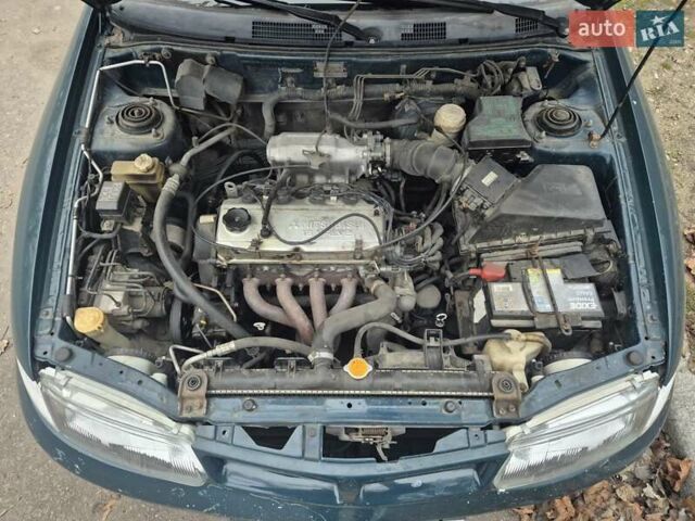 Зелений Міцубісі Харизма, об'ємом двигуна 1.8 л та пробігом 621 тис. км за 1399 $, фото 6 на Automoto.ua