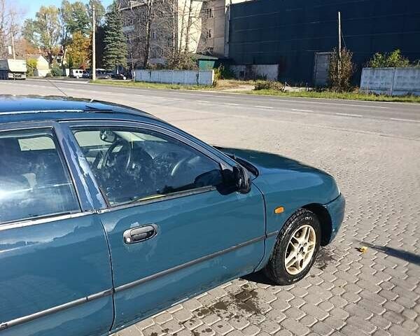Зеленый Мицубиси Харизма, объемом двигателя 1.6 л и пробегом 350 тыс. км за 1250 $, фото 6 на Automoto.ua