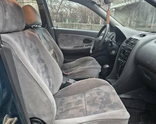 Зелений Міцубісі Харизма, об'ємом двигуна 1.8 л та пробігом 621 тис. км за 1399 $, фото 8 на Automoto.ua