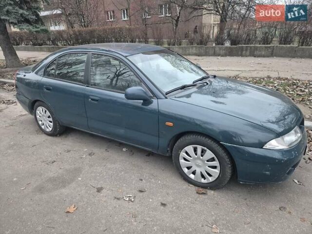 Зелений Міцубісі Харизма, об'ємом двигуна 1.8 л та пробігом 621 тис. км за 1399 $, фото 3 на Automoto.ua