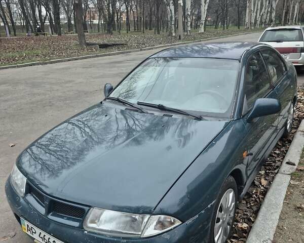 Зелений Міцубісі Харизма, об'ємом двигуна 1.8 л та пробігом 621 тис. км за 1399 $, фото 1 на Automoto.ua