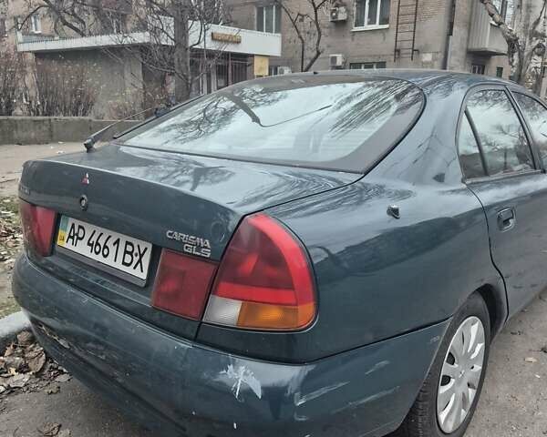 Зелений Міцубісі Харизма, об'ємом двигуна 1.8 л та пробігом 621 тис. км за 1399 $, фото 4 на Automoto.ua
