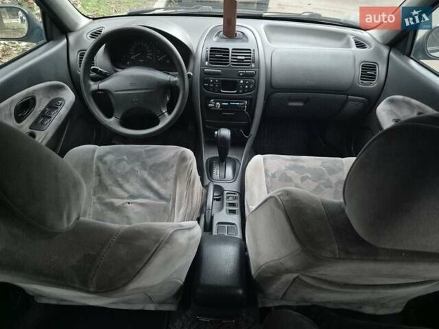 Зелений Міцубісі Харизма, об'ємом двигуна 1.8 л та пробігом 621 тис. км за 1399 $, фото 11 на Automoto.ua