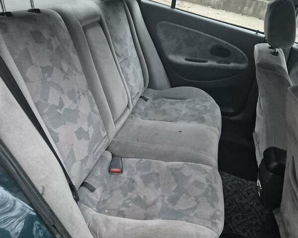 Зелений Міцубісі Харизма, об'ємом двигуна 1.8 л та пробігом 621 тис. км за 1399 $, фото 12 на Automoto.ua