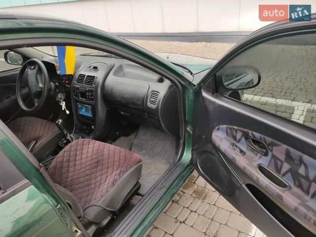 Зеленый Мицубиси Харизма, объемом двигателя 1.83 л и пробегом 255 тыс. км за 3500 $, фото 18 на Automoto.ua