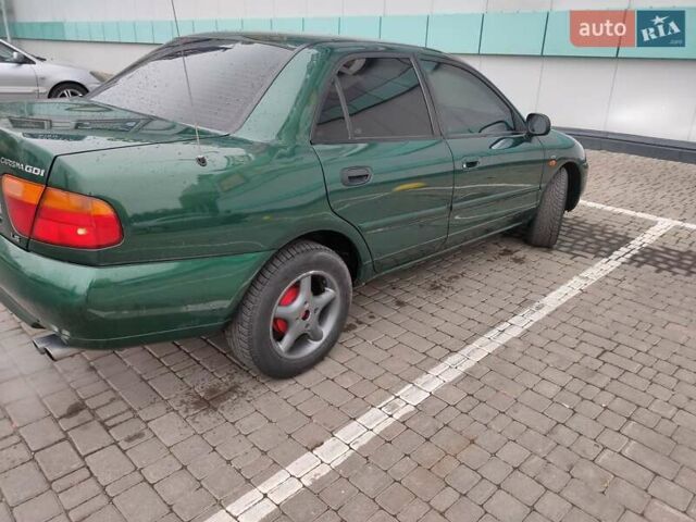 Зеленый Мицубиси Харизма, объемом двигателя 1.83 л и пробегом 255 тыс. км за 3500 $, фото 5 на Automoto.ua