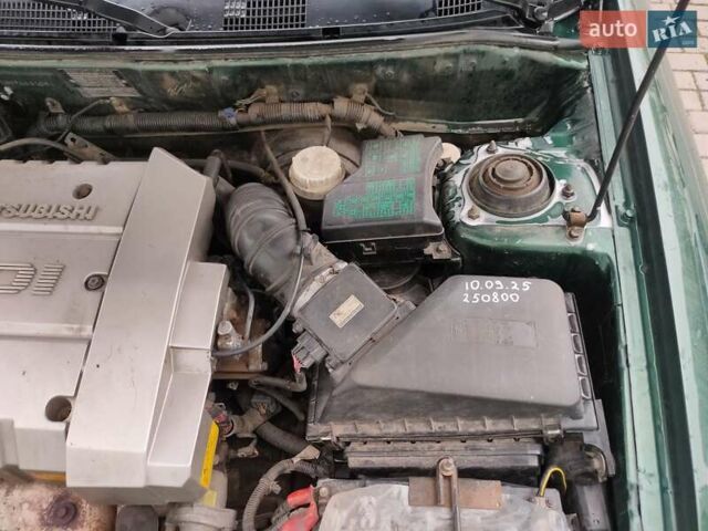 Зеленый Мицубиси Харизма, объемом двигателя 1.83 л и пробегом 255 тыс. км за 3500 $, фото 13 на Automoto.ua