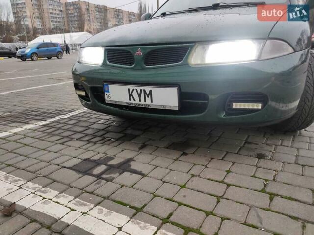 Зеленый Мицубиси Харизма, объемом двигателя 1.83 л и пробегом 255 тыс. км за 3500 $, фото 22 на Automoto.ua