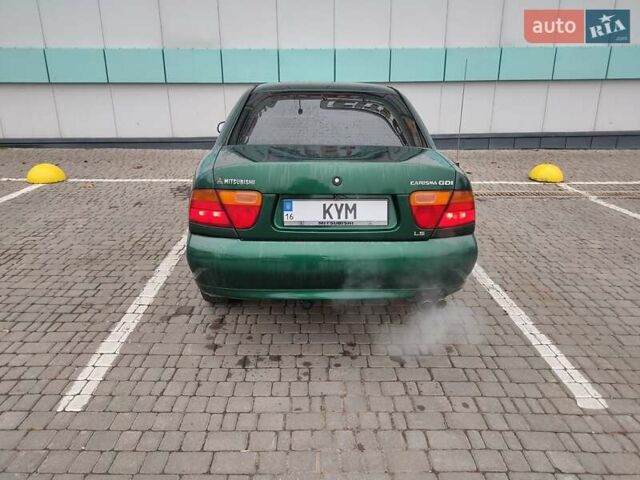Зеленый Мицубиси Харизма, объемом двигателя 1.83 л и пробегом 255 тыс. км за 3500 $, фото 7 на Automoto.ua