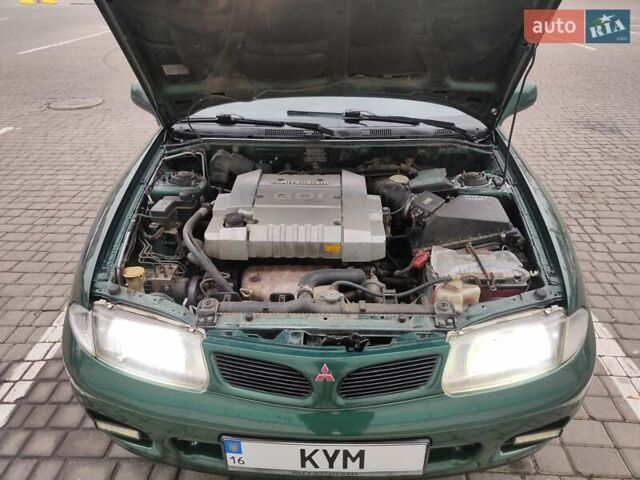 Зеленый Мицубиси Харизма, объемом двигателя 1.83 л и пробегом 255 тыс. км за 3500 $, фото 15 на Automoto.ua