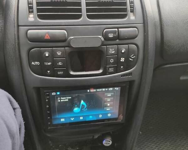 Зеленый Мицубиси Харизма, объемом двигателя 1.83 л и пробегом 255 тыс. км за 3500 $, фото 8 на Automoto.ua