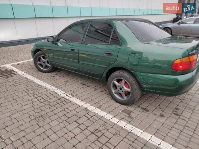 Зеленый Мицубиси Харизма, объемом двигателя 1.83 л и пробегом 255 тыс. км за 3500 $, фото 6 на Automoto.ua