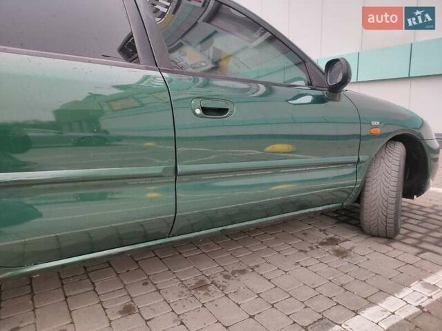 Зеленый Мицубиси Харизма, объемом двигателя 1.83 л и пробегом 255 тыс. км за 3500 $, фото 4 на Automoto.ua