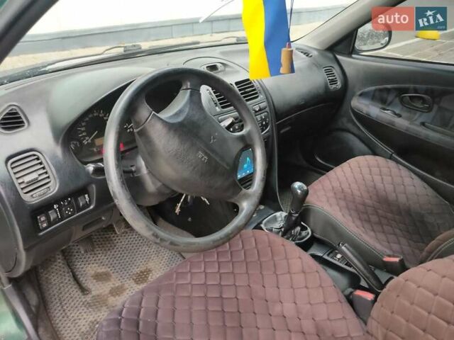 Зеленый Мицубиси Харизма, объемом двигателя 1.83 л и пробегом 255 тыс. км за 3500 $, фото 19 на Automoto.ua