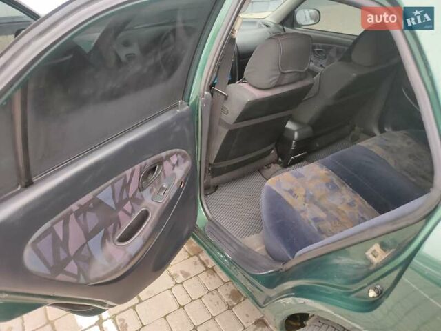 Зеленый Мицубиси Харизма, объемом двигателя 1.83 л и пробегом 255 тыс. км за 3500 $, фото 20 на Automoto.ua