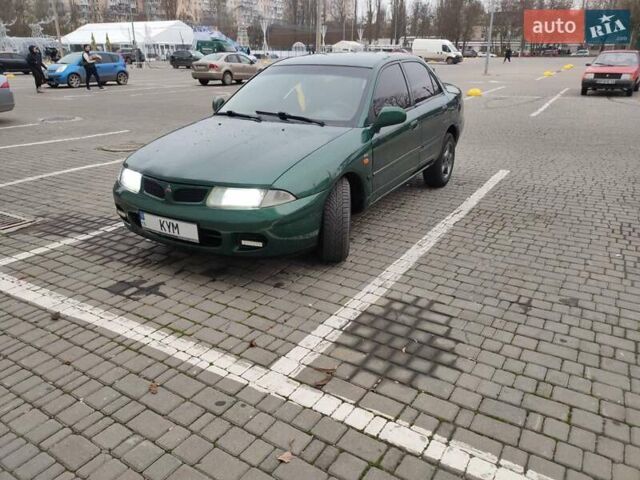 Зеленый Мицубиси Харизма, объемом двигателя 1.83 л и пробегом 255 тыс. км за 3500 $, фото 3 на Automoto.ua