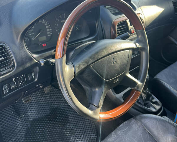 Зелений Міцубісі Харизма, об'ємом двигуна 1.8 л та пробігом 314 тис. км за 2000 $, фото 9 на Automoto.ua