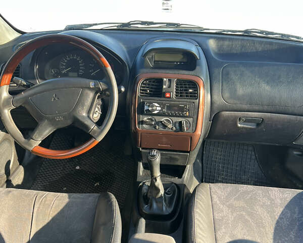 Зелений Міцубісі Харизма, об'ємом двигуна 1.8 л та пробігом 314 тис. км за 2000 $, фото 10 на Automoto.ua