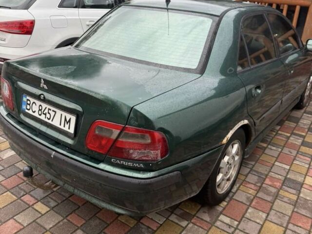 Зеленый Мицубиси Харизма, объемом двигателя 1.8 л и пробегом 300 тыс. км за 1400 $, фото 2 на Automoto.ua