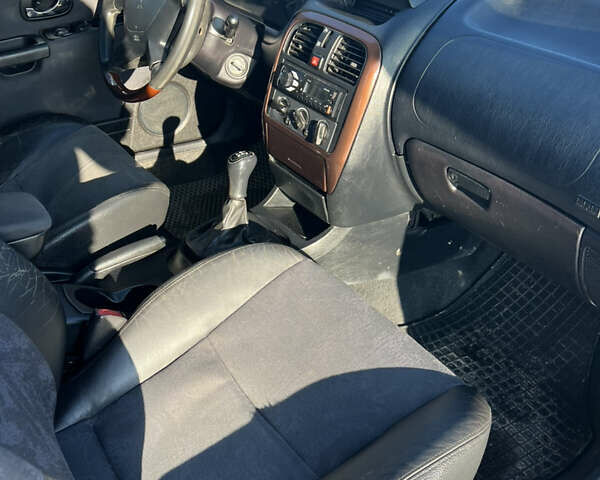 Зелений Міцубісі Харизма, об'ємом двигуна 1.8 л та пробігом 314 тис. км за 2000 $, фото 11 на Automoto.ua