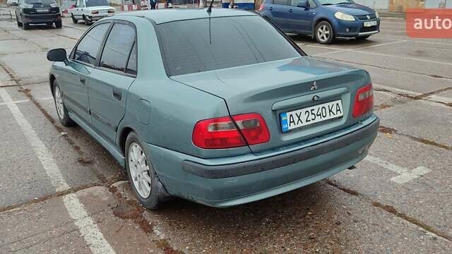 Зеленый Мицубиси Харизма, объемом двигателя 1.6 л и пробегом 375 тыс. км за 3500 $, фото 5 на Automoto.ua